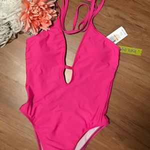 Hot pink one piece Gianni Bini bathing suit.